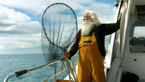 fisherman holding fishing net