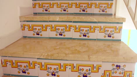 typical spanish ceramic tiles on stair risers inside a home in spain