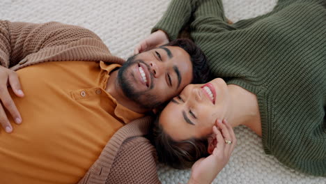 kiss, love and couple on the floor of their living