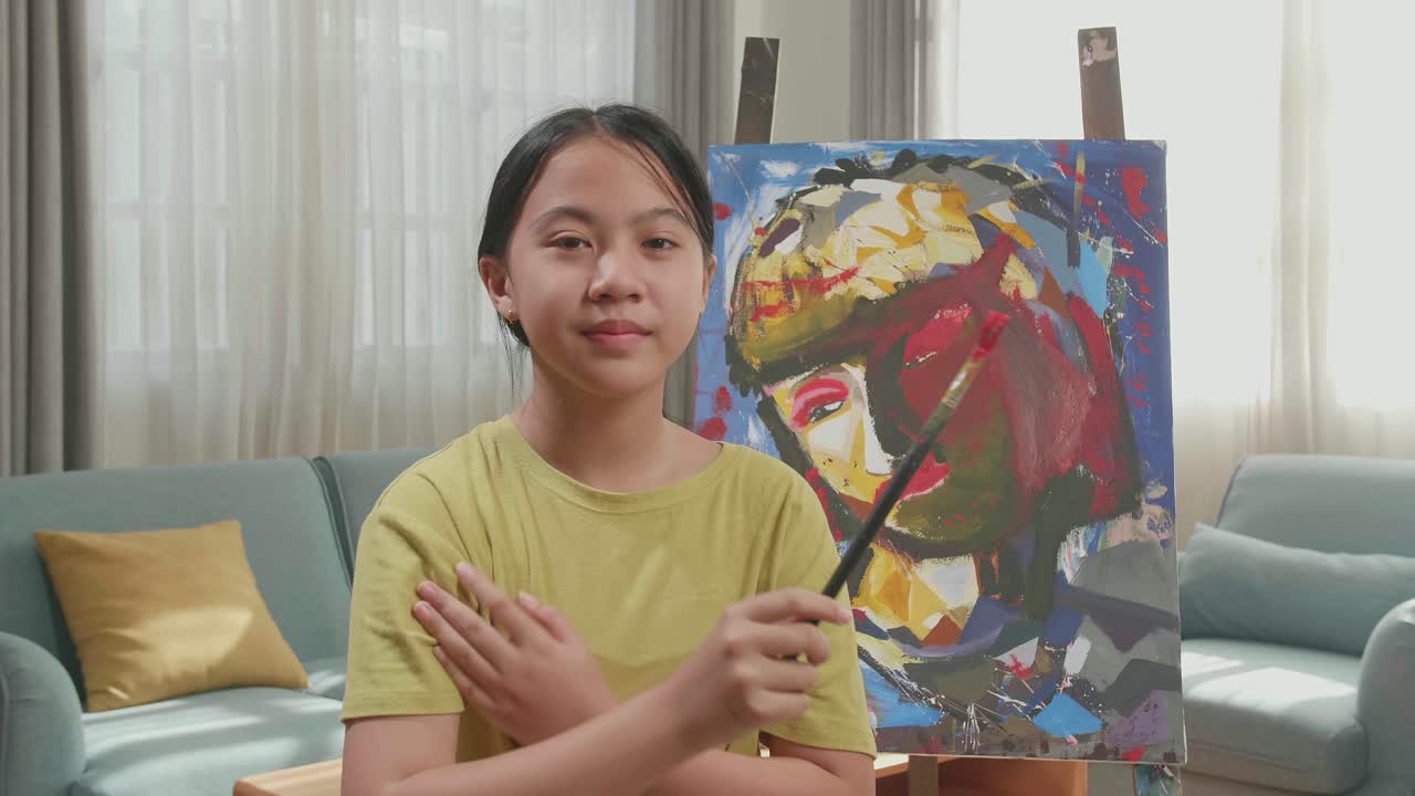 Asian Artist Girl Holding Paintbrush Wipe The Sweat Before Crossing His Arms And Smiling After Finish Painting On The Canvas