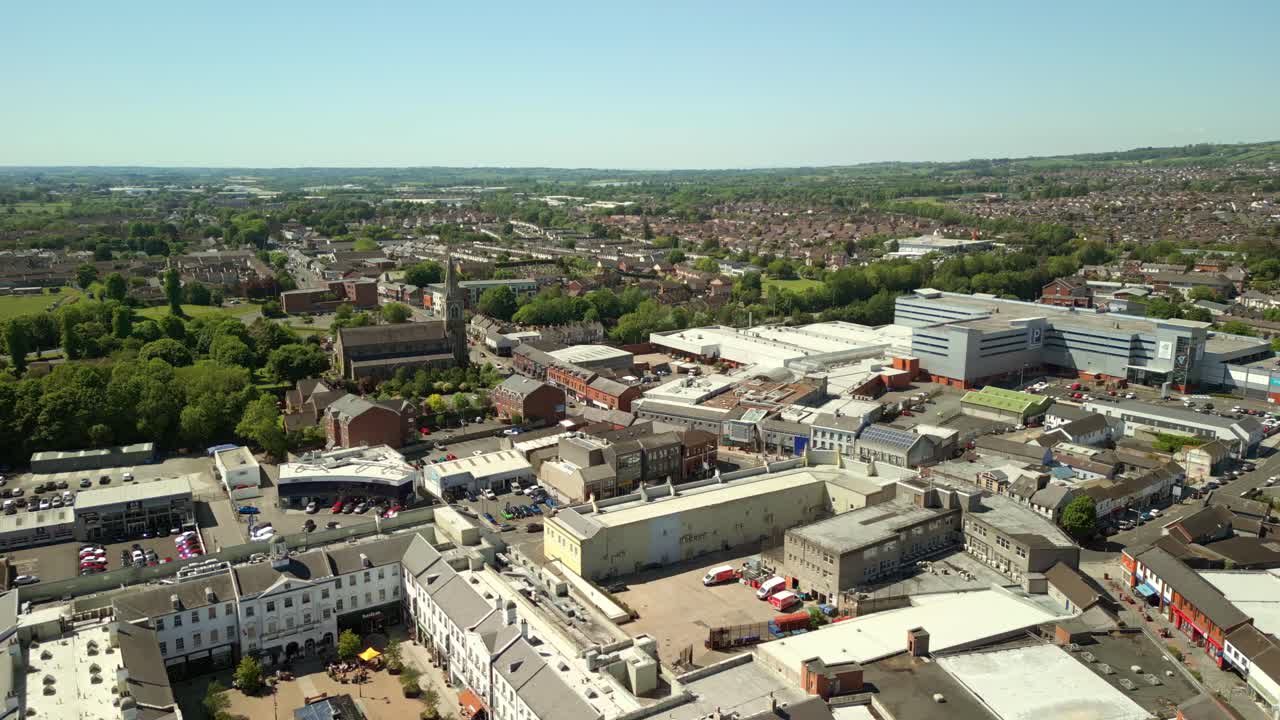 Reversing rising aerial video of Lisburn, Northern Ireland, UK on a bright and sunny day. Filmed in 4K, 60FPS and with Rec709 Color.