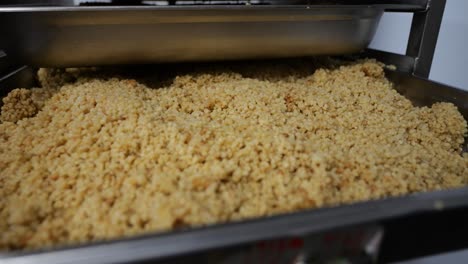 Close-up-shot-of-finished-food-on-shelves-ready-to-serve-in-a-food-factory