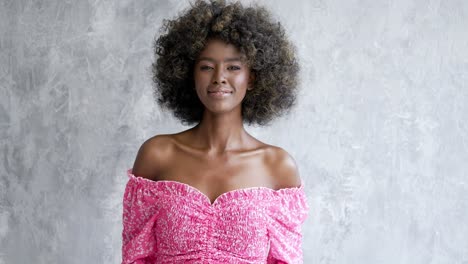 smiling woman in pink dress