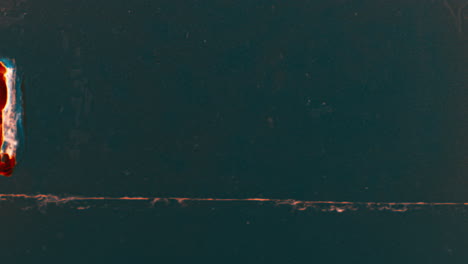 dark green surface with marks and orange border