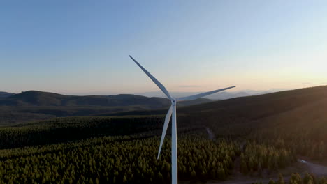 giant wind energy converter sitting high above the valley