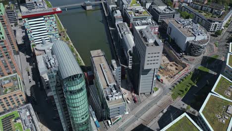 reveal, dusseldorf cityscape and vertical cantilever structure rhine tower