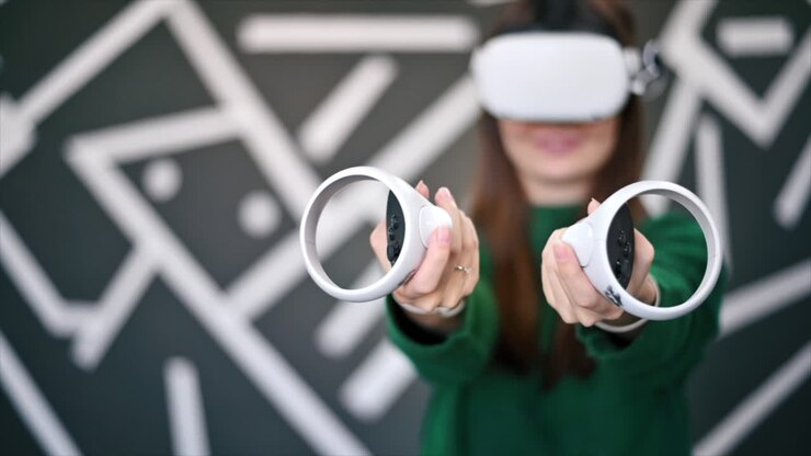 A young interested woman playing in VR games using VR glasses and controllers. Slow motion