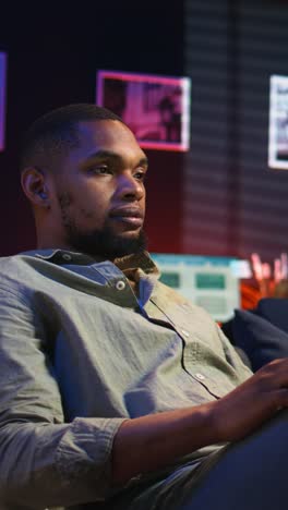 vertical video black male freelancer taking online course to learn new skills from home