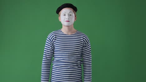 excited mime artist giving thumbs up gesture