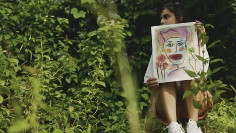 traveling shot of a young indian artist as she explores the enchanting indian forest