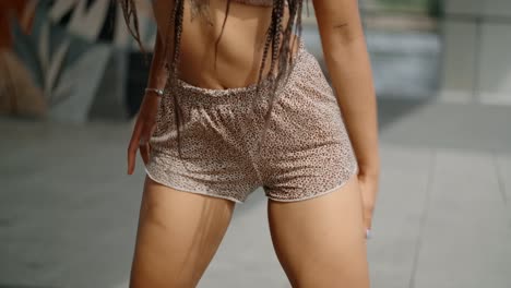 woman dancing in shorts