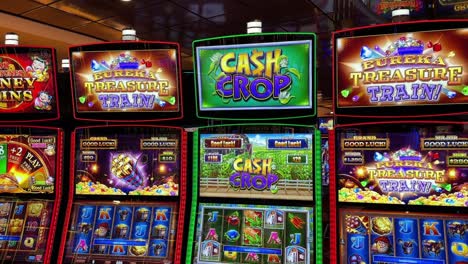 casino floor with different types of colorful slot machines, tilting up view