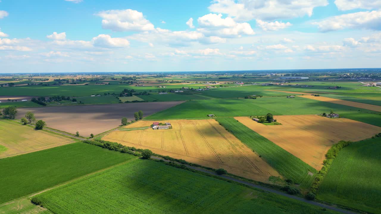 Aerial top view of a different agriculture fields in countryside on a spring day