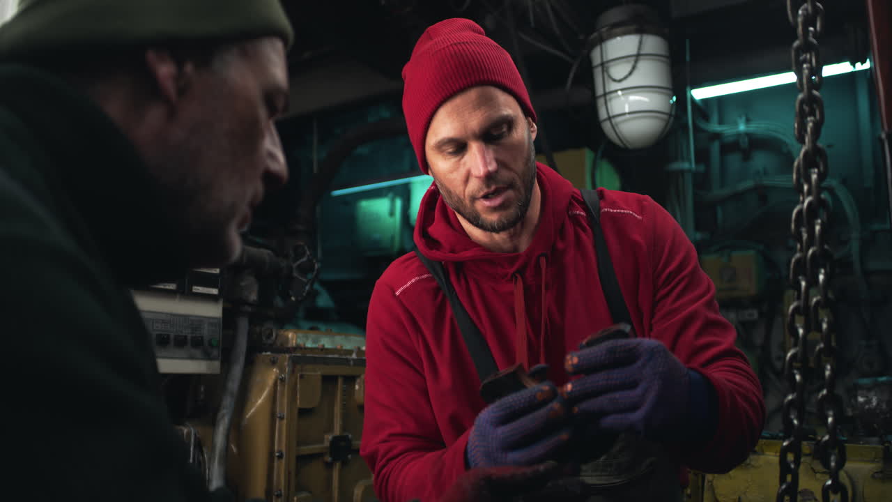 Ship Workers Inspecting Engine Parts