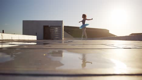 ballet dancer practicing on rooftop