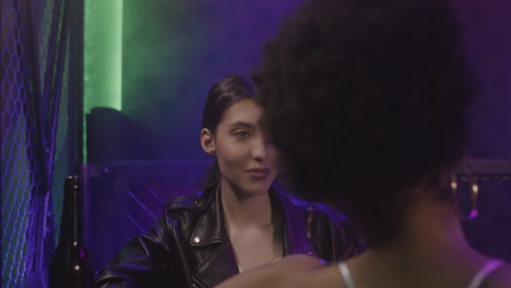 Beautiful-Girl-With-Braces-Drinking-Beer-And-Laughing-With-Her-Friend-At-Disco