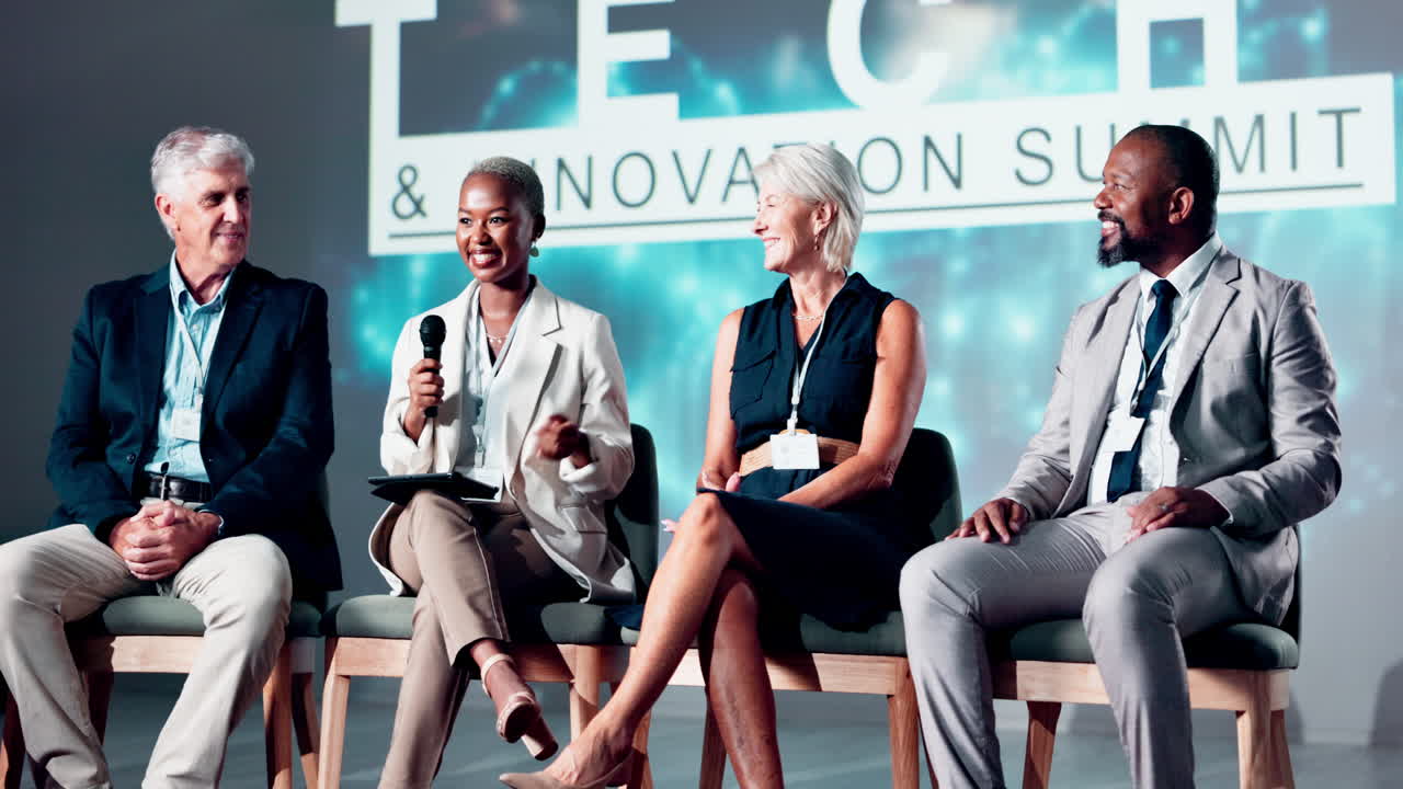 Diverse Business Panelists Clapping and Speaking at a Tech Summit
