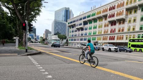 cyclist and vehicles crossing city intersection