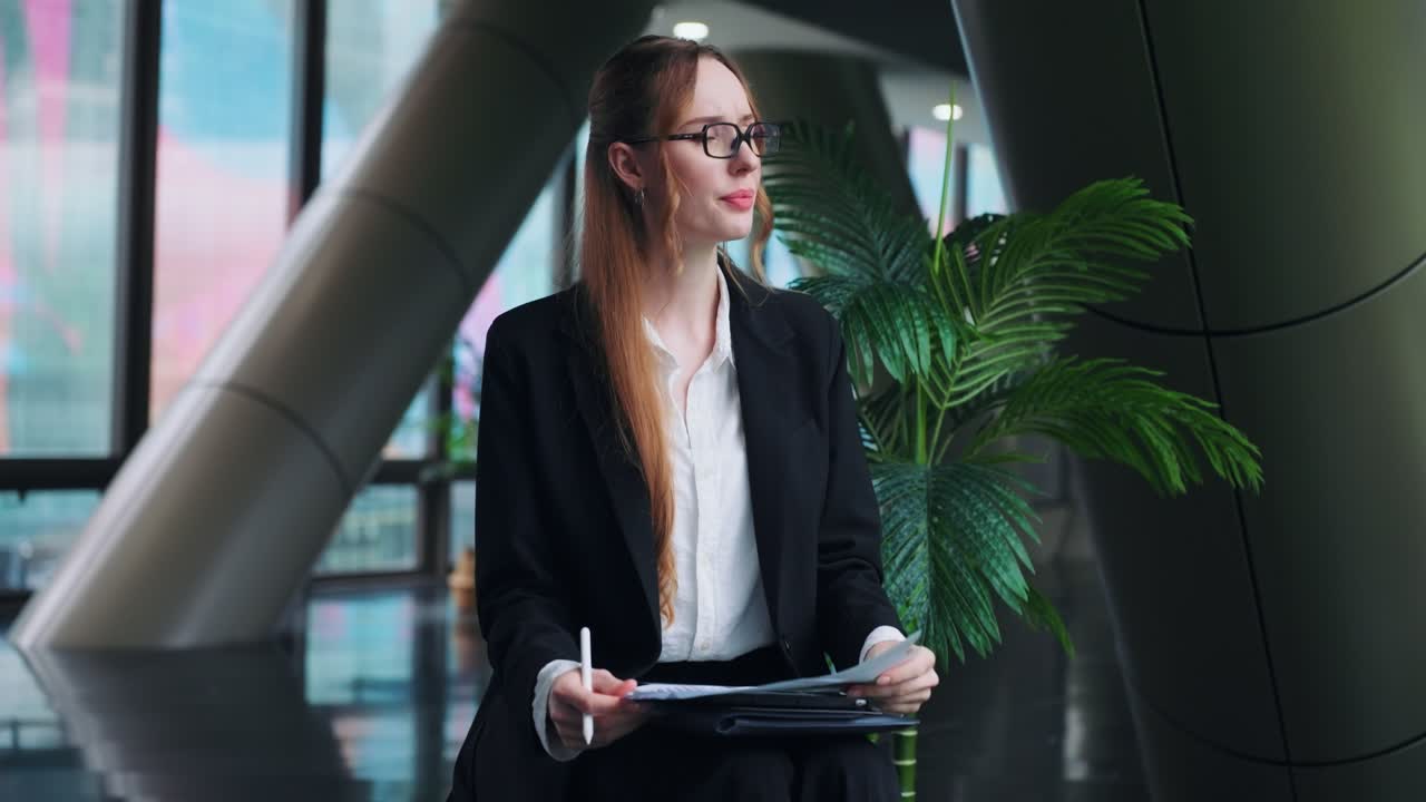 Stressed and unhappy businesswoman in slow motion, showing frustration and disbelief while analyzing a business report with bad financial results in a modern office