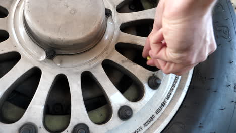 Close-Up-Pilot-Checks-Tire-Pressure-of-Airplane-Wheel