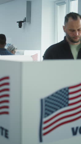 Female-American-soldier-comes-to-vote-in-booth-in-polling-station-office.-National-Election-Day-in-the-United-States.-Political-races-of-US-presidential-candidates.-Concept-of-civic-duty.-Dolly-shot.