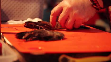 shrimp being cut and cooked in street market south korea