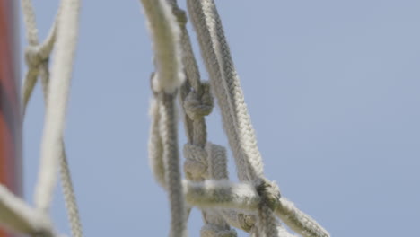 Close-up of the goalkeeper&#039;s net swaying in the wind against a blue sky