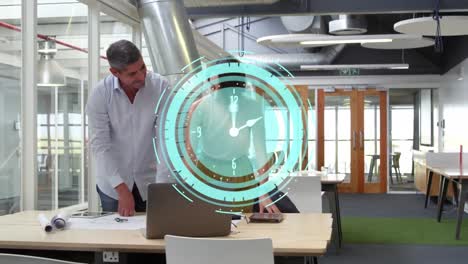 Animation-of-clock-moving-fast-over-business-colleagues-using-laptop-in-office