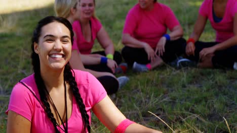 portrait of female trainer relaxing during obstacle course