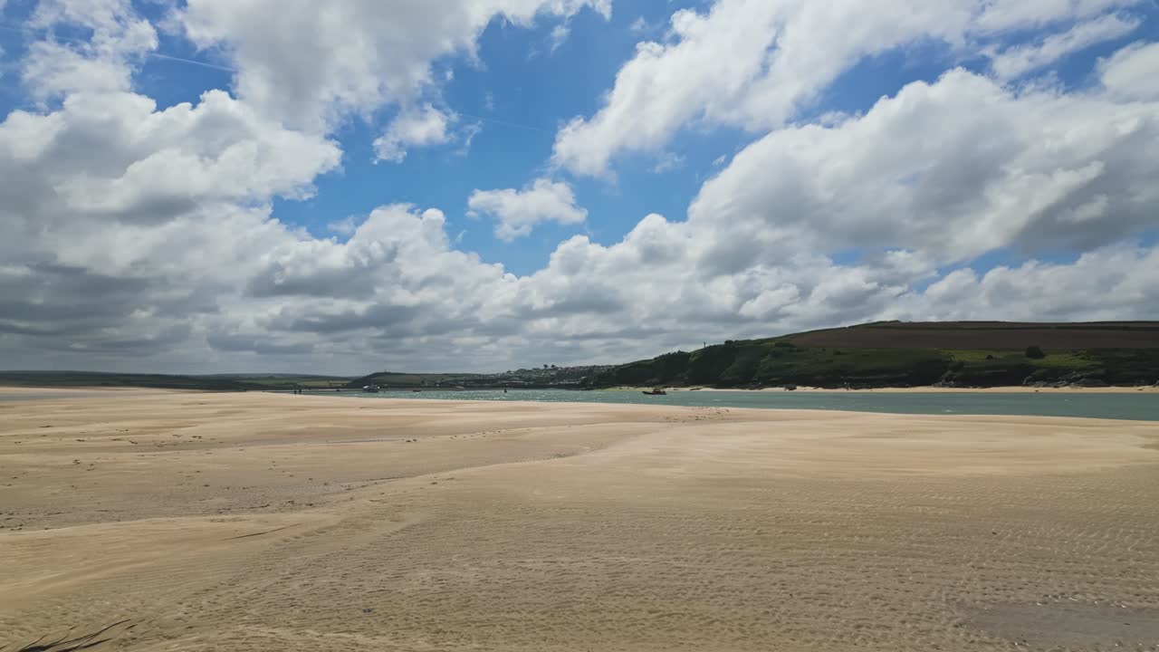 Pan, left to right from Daymer Bay towards Padstow at low tide, sand in foreground
