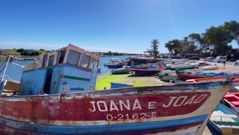 Fishing-days-finished,-no-longer-going-to-sea-in-The-Atlantic,-sad-remains-of-a-once-proud-working-boat-Algarve-Portugal