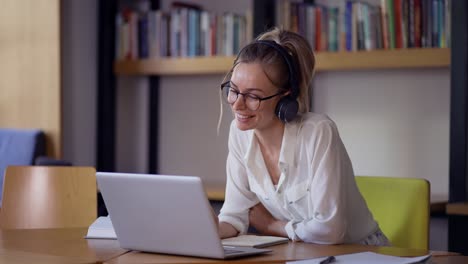 Blonde-woman-study-at-distant-learning-at-library