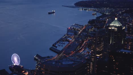 cinematic helicopter building reveal of city waterfront