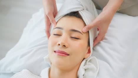 woman receiving a facial massage