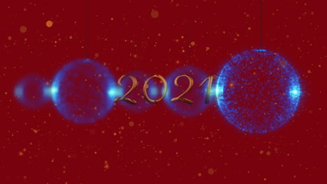 animation of 2021 text over christmas decoration on red background