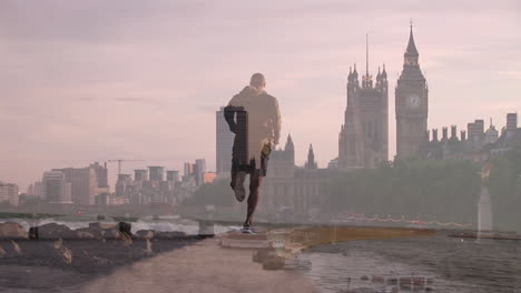 animation of caucasian male runner running over cityscape of london