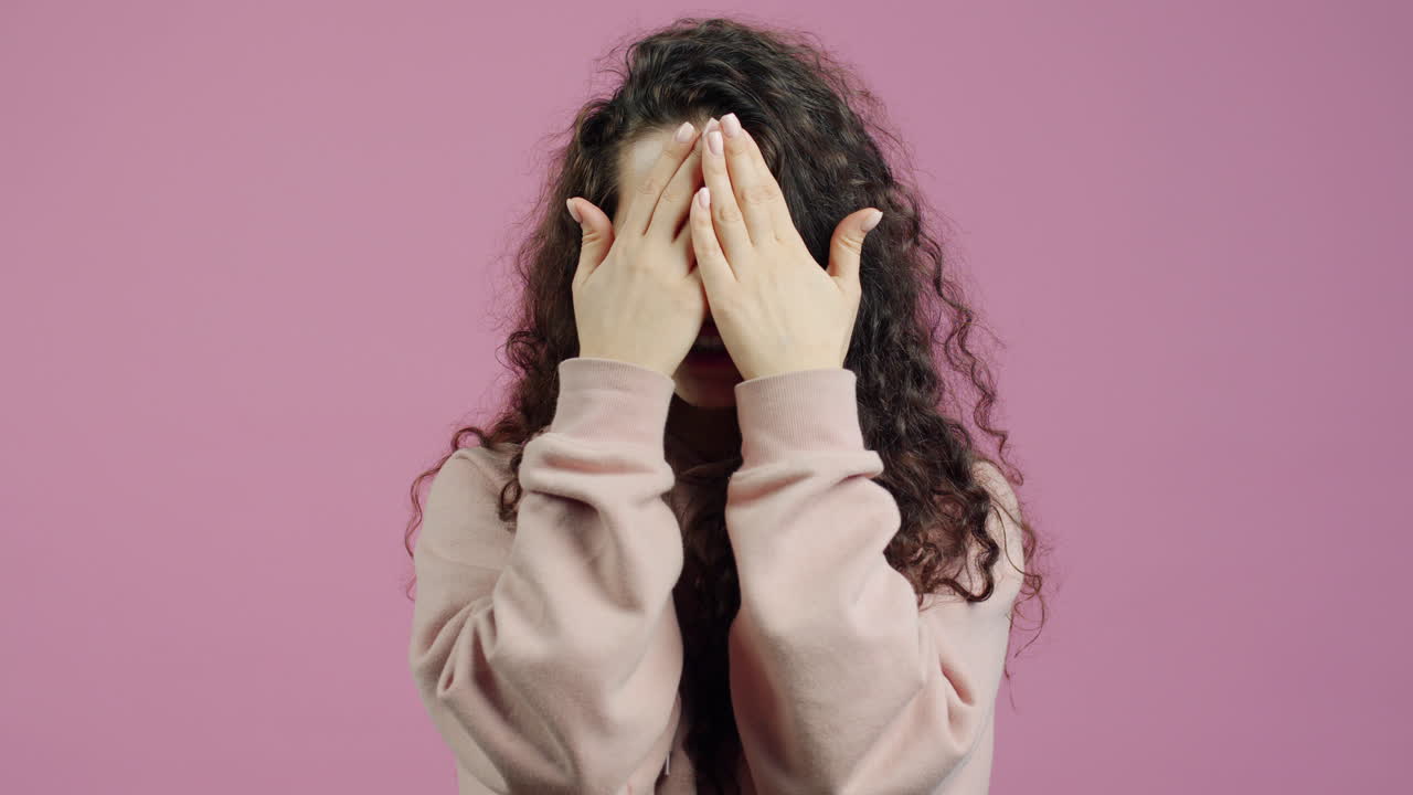 Woman Expressing Surprise and Hiding Face