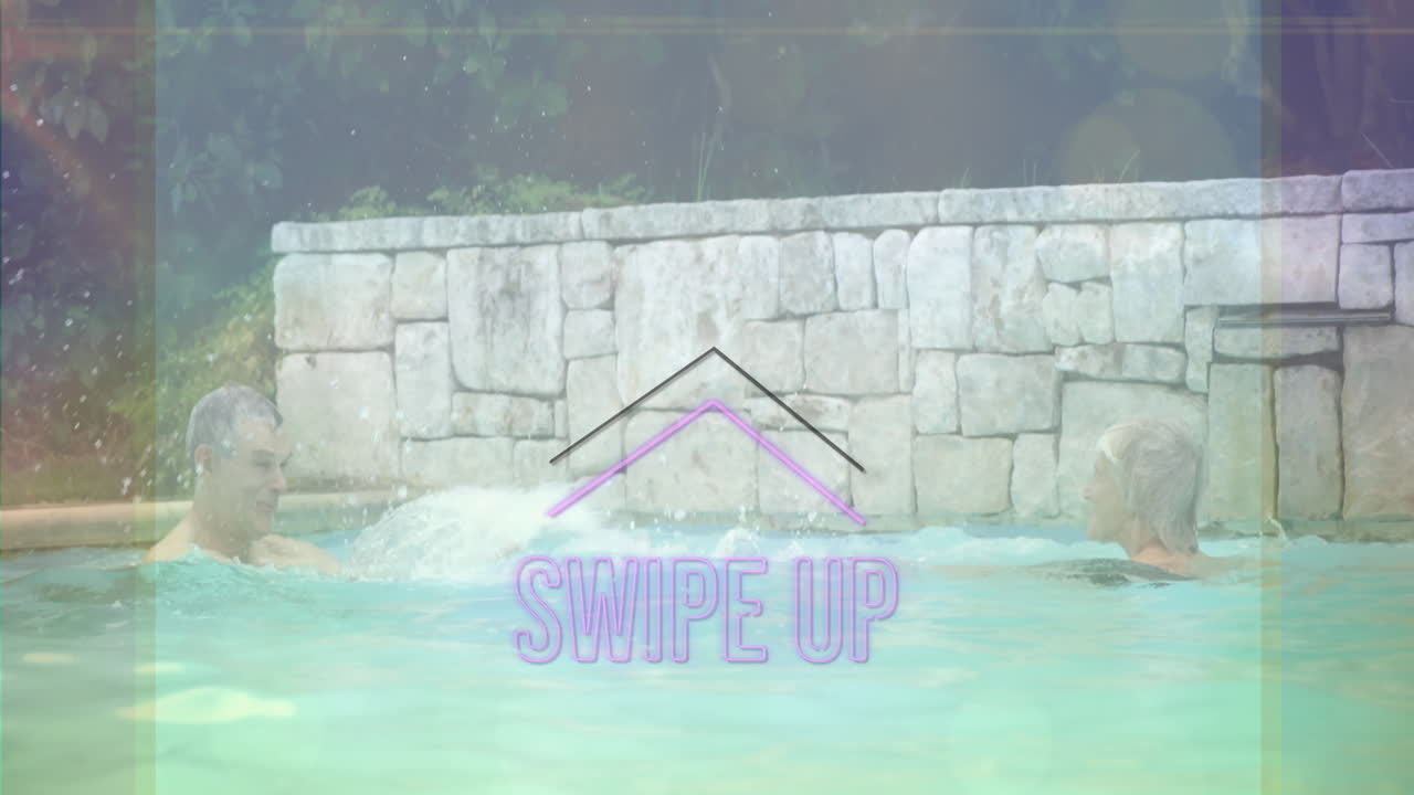 People swimming in pool with Swipe Up text animation over stone wall