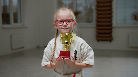 girl in white kimono in martial arts class