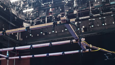 a special effects rain machine in a film cinema studio with a ceiling full of film lights