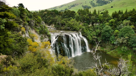 Aerial-View-Of-Amazing-Waterfall-In-Tropical-Rain-Forest-Jungle-in-New-Zealand