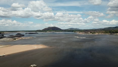 establishing aerial shot over the beautiful orinoco river with parima mountains