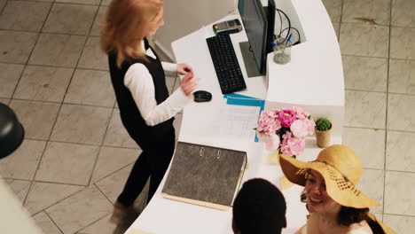 receptionist doing check in process