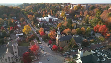 Aerial-ascent-of-churches-and-Denison-University-with-autumn-colors,-Granville,-Ohio