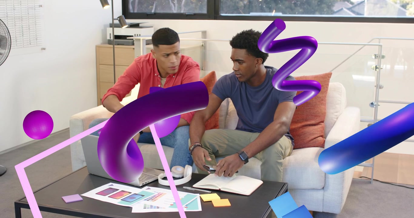 Two men on couch opening laptop and initiating design with color swatch overlay while noting