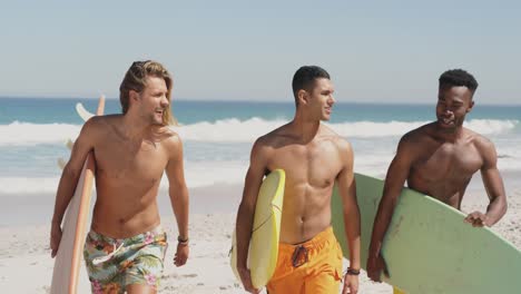 young men at the beach carrying surfboards 4k