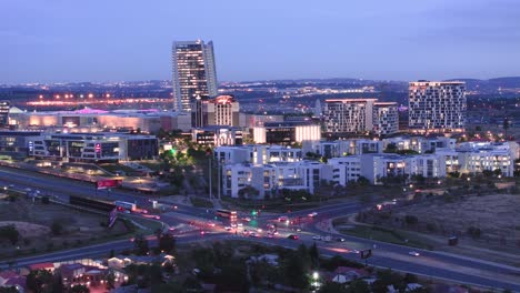 mall of africa in midrand, south africa, with city lights at dusk, aerial view