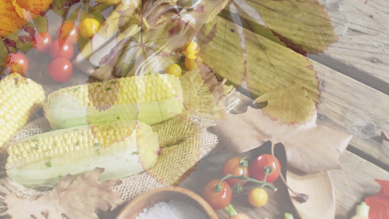 나무 바탕에 채소와 향신료 위에 잎의 애니메이션.