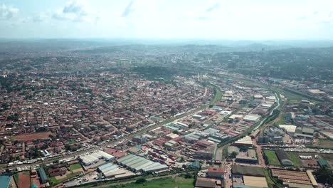Aerial-view-of-densely-populated-area-and-industrial-zone-in-Kampala,-Uganda