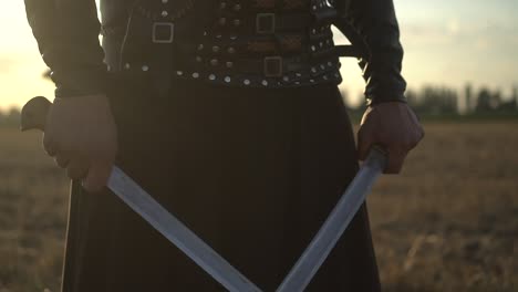 a cossack with two sabres in his hands looks into the distance at the enemy 01